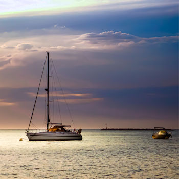 Sailboat moored to an anchor bouy