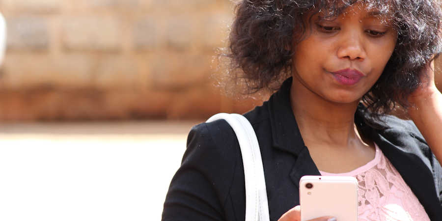 Frustrated woman with smartphone