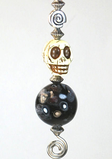 Skull with brown glass and spiral ceiling fan pull chain