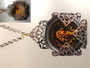 A Goddess Under Amber Glass Filigree Pendant