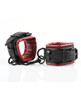 Close-up of Saffron red and black wrist cuffs with adjustable straps, padding, and metal hardware details