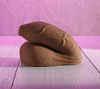 Deep-toned uncircumcised packer with detailed texturing, including pronounced veining, natural contours, and a defined foreskin. Features a smooth, skin-like finish with realistic anatomical shaping.