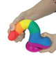 Side-angle view of the Get Lucky 7.5" Real Skin PRIDE Dildo showing the flexible shape,  the rainbow-striped shaft, realistic contouring, and round suction cup base.