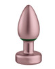 Close-up of the Femme Funn Bougie anodized aluminum butt plug showing the tapered tip, emerald accents, and wireless remote.