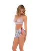 Rear view of the Sweet Dreams Lace & Floral Pajama Set showing the wireless lace bralette and floral flutter shorts with adjustable side ties.