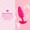B-Vibe Pink Bump Small Silicone Plug showing its tapered pink silicone body covered in soft, rounded raised texture and wide flared base.
