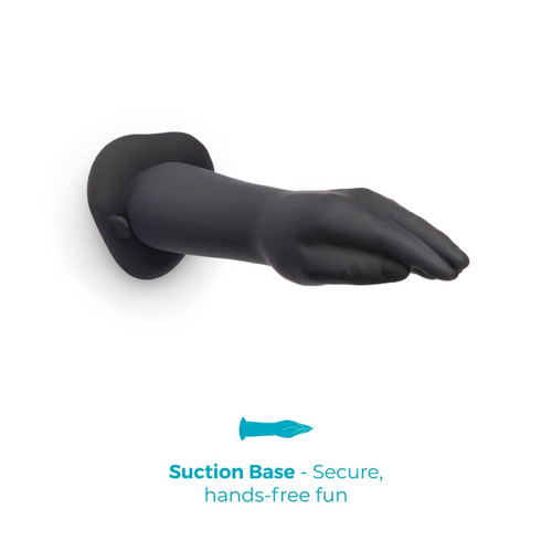 Side profile of the hand-shaped silicone dildo lying horizontally, emphasizing the natural arm contour, smooth surface, and sturdy suction cup base for stability.