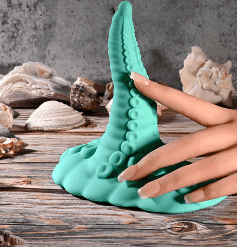 Close-up of curved silicone tentacle grinder with textured suckers and flexible shaft for targeted stimulation