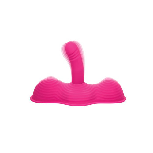 Pink ride-on vibrator with contoured grinding surface and flexible insertable shaft, designed for hands-free stimulation and multi-zone vibration.