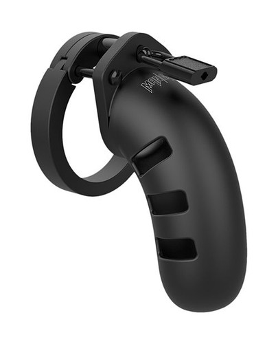 Exploded view of Man Cage chastity kit components showing cage, rings, spacers, locking pins, and included locks for custom assembly