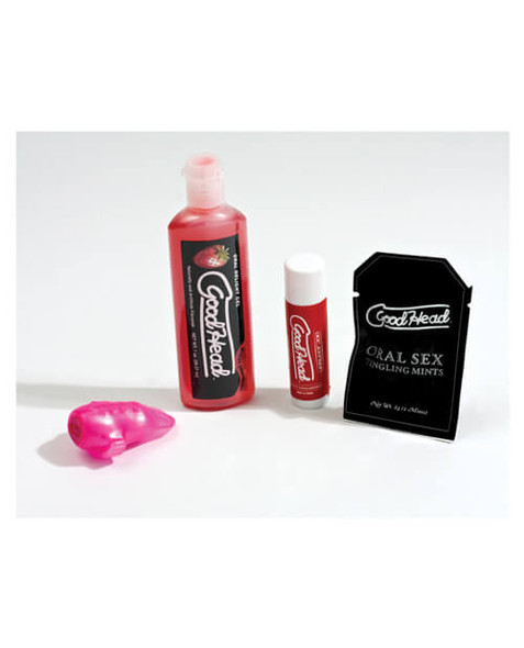 Close-up of the Good Head Oral Sex Kit contents showing the vibrating tongue ring, flavored oral products, and oral enhancement accessories designed specifically for women who love receiving oral sex.