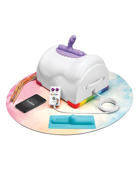 Unicorn ride-on sex machine with rainbow base, purple attachment, and control accessories