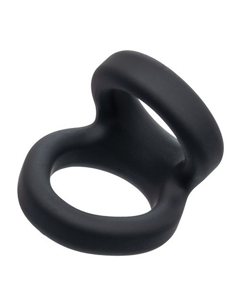 Side view of a black dual-ring cock ring with a sculpted bridge connecting the upper and lower loops. The soft silicone construction and rounded edges highlight its stretchable fit and supportive design for enhanced firmness and lift.