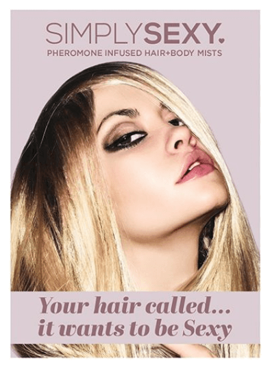 Woman applying hair fragrance mist to styled hair, showcasing lightweight scent spray for hair and skin