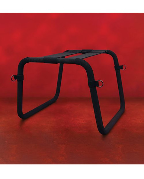 Front view of black queening and positioning stool with padded top, metal frame, and attached soft cuffs
