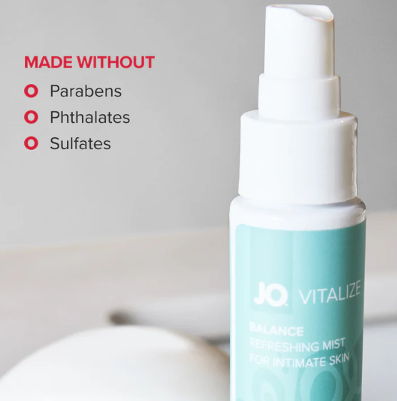JO Vitalize Balance Refreshing Intimate Mist bottle shown with “Made Without Parabens, Phthalates, and Sulfates” text against a clean bathroom background.