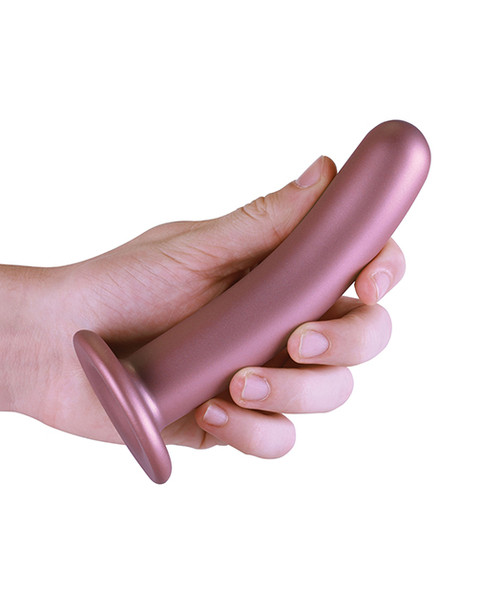 Smooth As Silk Rose Gold Silicone Dildo held in hand