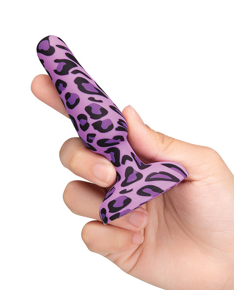 Side view of b-Vibe Leopard Novice Plug held inhand showing tapered tip and flared base