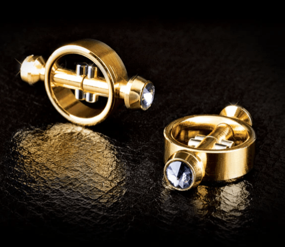 Gold magnetic nipple clamps with circular ring design, featuring smooth metal finish and integrated magnets for controlled pressure and secure fit