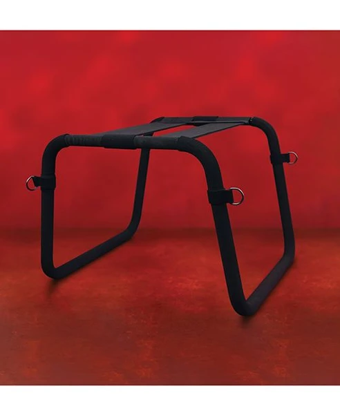 Front view of black queening and positioning stool with padded top, metal frame, and attached soft cuffs
