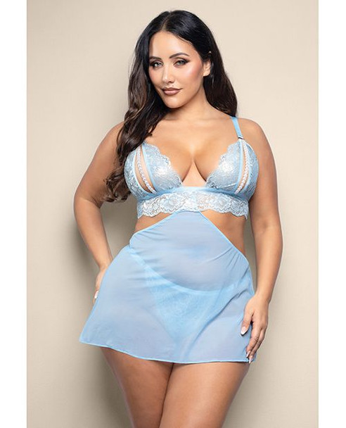 Opulence Light Blue Pearl & Lace 2-In-1 Set shown from the front featuring metallic light blue lace, a sheer mesh overlay skirt, split pearl-detail cups, and matching pearl-accent lingerie underneath.