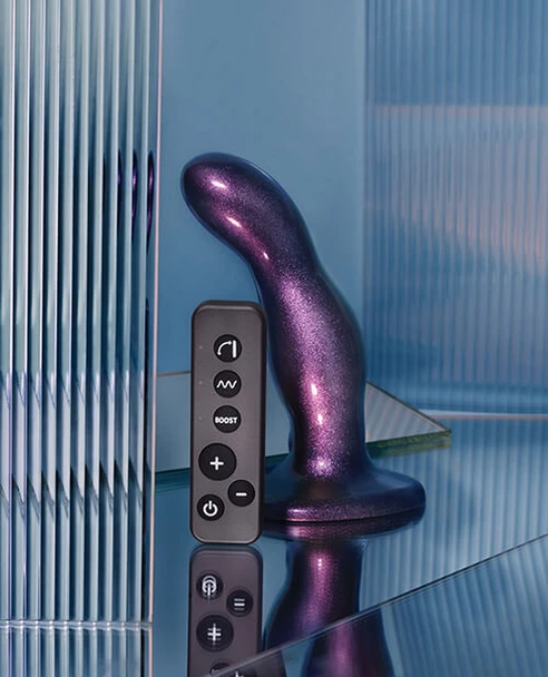 Strap-On-Me Fingering & Vibrating Dildowith remote control displayed on a glass table