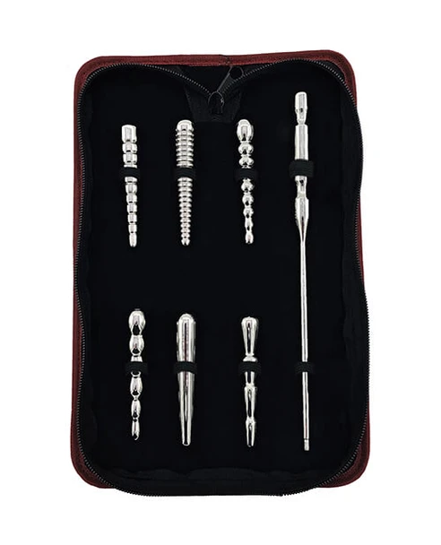 Six stainless steel urethral plugs and interchangeable handle displayed in a fitted luxury storage case