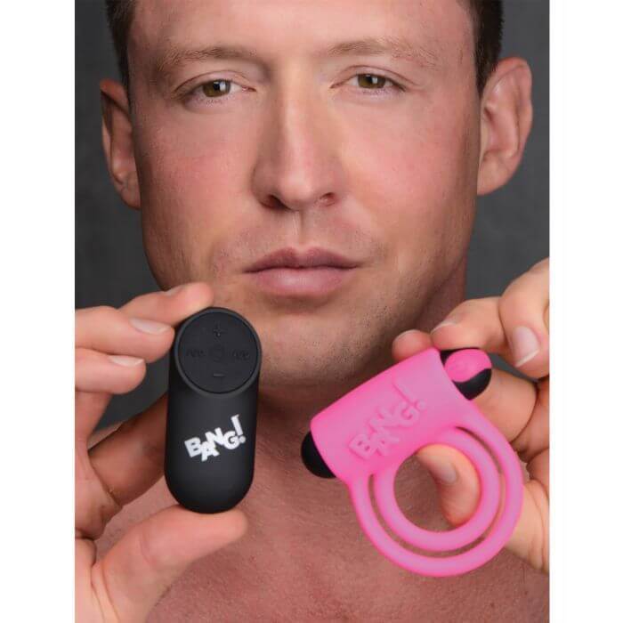 Pink vibrating silicone cock ring for couples