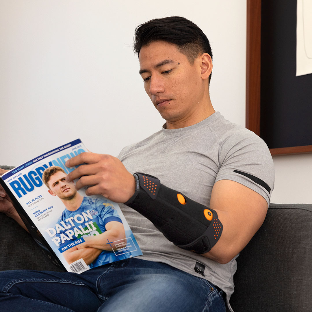 Myovolt vibration therapy wrist brace for muscle pain relief at home.