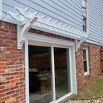 Cedar Bracket 14T10 — installed over door | Timber Build