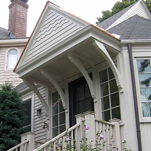 Front porch enhanced with wood knee braces