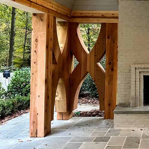 The design features heavy timber post and beam construction