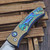 Pro-Tech Knives 2026 Duke Custom 003 2-Tone Gold/Blue Titanium Handle Abalone Inlay & Button Mike Irie 2.7" 154CM Mirror Polish Blade Blue Ti Clip