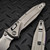 MICROTECH SOCOM DELTA RAM-LOK T/E MARFIONE SELECT STONEWASH TITANIUM W/PURPLE TI ACCENT 163RL-10MS4
