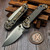 Microtech LUDT Ram-Lok Manual Flamed Frag Titanium 3.4" Clip Point Stonewash M390MK Blue Ti Accent Marfione Select 1135RL-10FRMS4