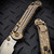 Microtech LUDT Ram-Lok Manual Flamed Grooved Titanium 3.4" Clip Point Stonewash M390MK Bronze Ti Accent Marfione Select 1135RLG-10MS3