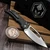 Heretic Custom Koschei S/E Mirror Polish Carbon Fiber Scales Abalone Button Manual Crossbar Lock