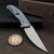 Shirogorov Knives Ursus Q95 with Blue Titanium back view with clip.