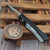 Pro-Tech Knives Duke 2 Custom White Pearl Inlay & Button 2.7" Mike Irie Mirror Polish Compound Grind Blade Blue Ti Clip Satin HW Blade Show West 2026