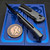Chaves Knives Redencion Street X-Lock with Grey handle and 3.25" D2 Black PVD Tanto blade side view.
