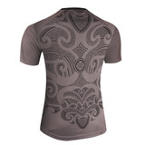 A grey jersey featuring intricate black patterns on the back and a logo on the front.