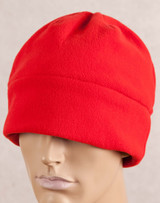 A red polar beanie displayed on a mannequin head, featuring a soft, warm fabric design.