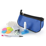 A blue cosmetic pouch contains a white lip balm, a dispenser, a pen, colorful sticky notes, and small white tablets.