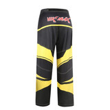 Ice hockey pants in black and yellow, featuring a logo on the back. The design includes bold, wavy patterns.