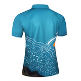 A turquoise polo jersey featuring Aboriginal art designs in vibrant colours. The shirt has a logo on it.