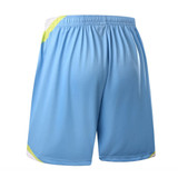 Light blue soccer shorts featuring a neon yellow trim and an elastic waistband, with a logo on the side.