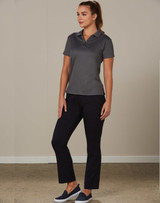Ladies' utility cargo pants in black, paired with a grey polo shirt, model standing in a neutral setting.