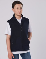 A diamond fleece vest in navy worn by a child, featuring a zip fastening and side pockets.