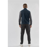 A men's fleece vest in navy blue, featuring a zip-up collar and a plain design, paired with dark trousers.