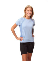 A light blue ladies' t-shirt with short sleeves, featuring side panels, worn by a smiling model.